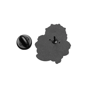 Detail of the black metal brooch back showing the secure pin and rubber clutch attachment