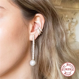 Elegant S925 sterling silver pearl drop earrings and zircon ear cuffs worn by a model