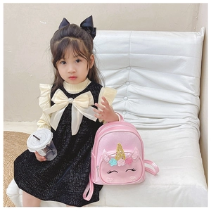 Pink leather unicorn backpack featuring gold glitter horn and sequin floral details