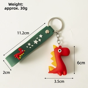 Detail view of red silicone dinosaur keychain with green strap and dimension markings