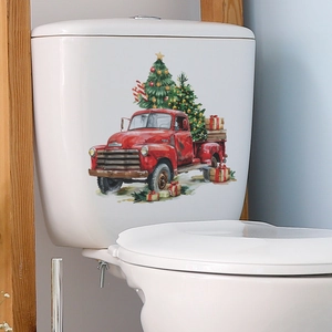 Christmas toilet tank sticker with vintage red truck and tree on white ceramic surface