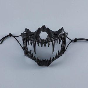 Detailed view of black tactical half-face beast mask with sharp fangs and bone texture