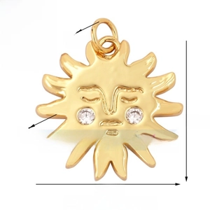 Macro view of a 16mm gold celestial sun face pendant with zircon eyes and dimensions