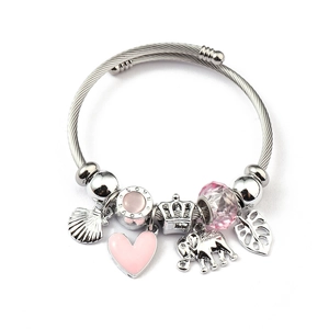 Silver beaded charm bracelet with pink heart, elephant, and shell pendants on white background