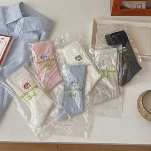 Colorful cotton mid-calf socks with Fun Time embroidery in various pastel shades