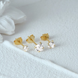 Detail view of S925 sterling silver gold earrings set with heart-cut stones and S925 hallmark