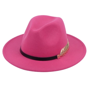 Pink wool fedora hat with black leather band and gold metal leaf detail on white background