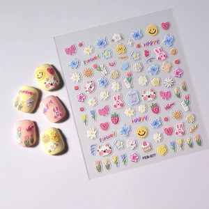 Macro detail of 3D embossed nail stickers featuring spring flowers and cartoon animals