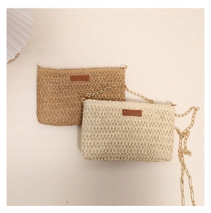 Detailed flat lay of small woven straw crossbody bags in khaki and beige colors
