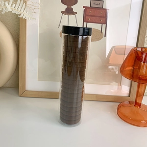Deep brown high-elastic hair ties set neatly stored in a clear cylindrical plastic bottle