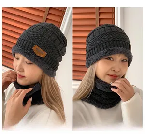 Detail of dark grey knit beanie and neck warmer set with thick fleece lining