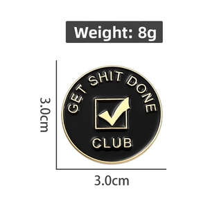 Black round Get Shit Done Club enamel pin with gold lettering and checkmark icon