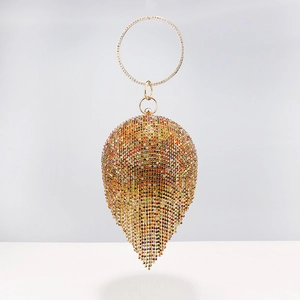 Detail showing the colorful rhinestones and gold fringe on this drop-shaped evening bag