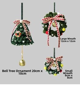 Detail view of handmade Christmas plush tree and wreaths with bells and pearls