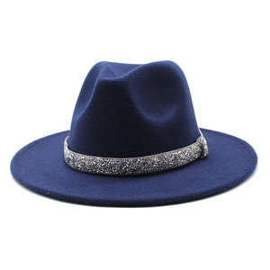 Close-up of navy blue wool jazz hat with a shimmering silver rhinestone crystal band