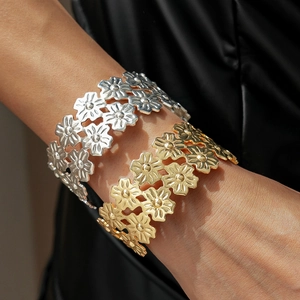 Double-layered wide floral hollow cuff bracelet in polished gold and silver metal finishes