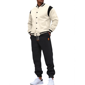 Men's casual cream and black baseball jacket set with matching joggers on a model