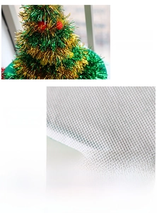 Detail of Christmas tree hat with sequins, colorful LED lights and non-woven fabric texture