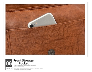 Close-up of brown litchi grain leather shoulder bag featuring a magnetic snap and front pocket