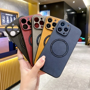 Magnetic nubuck leather cases for iPhone in five colors held in hand showing charging ring