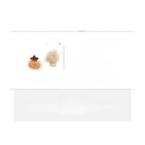 Detailed view of star-shaped plush earrings with light brown faux fur and silver pins