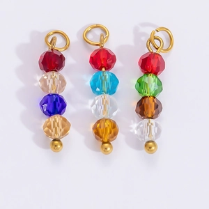 Close-up of DIY colorful faceted crystal bead pendants with 18k gold plated ring loops