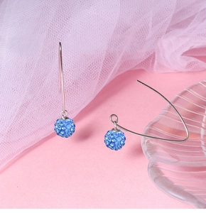 Detailed close-up of S925 silver hooks with sparkling blue rhinestone pave ball earrings