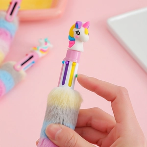 Close-up of cute unicorn plush multi-color pen with rainbow faux fur and functional buttons