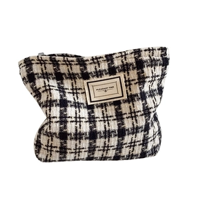Classic black and white tweed plaid cosmetic bag with silver zipper and vintage label