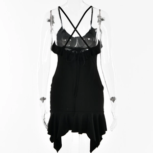 Detail of backless V-neck dress with crisscross straps and ruffled hem design