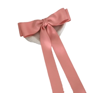 Pink satin oversized ribbon bow hair clip with long streamers in balletcore style