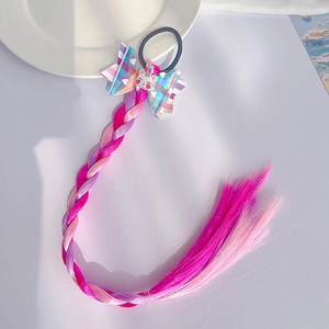 Detail of pink and purple gradient braided wig extension with unicorn bow hair tie
