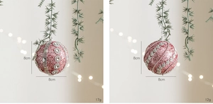 Detail view of 8cm pink glitter foam Christmas baubles with silver rhinestone patterns