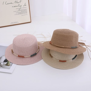 Summer girls woven straw hats in pink and beige colors for beach sun protection