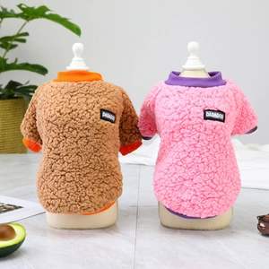 Detail view of warm fleece dog sweater in brown and pink colors with soft lamb velvet texture