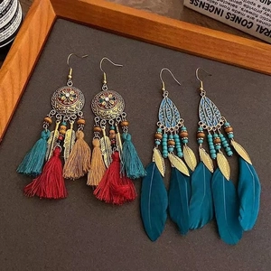Bohemian tassel and feather drop earrings with vintage metal ethnic totem designs
