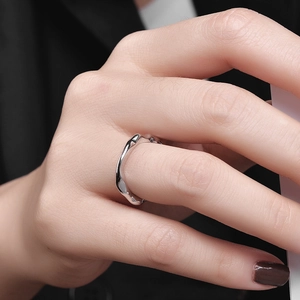 Minimalist S925 sterling silver open ring with irregular wavy texture on dark background