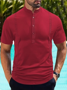 Detailed view of men's red polo shirt with stand collar and vertical stripe accents
