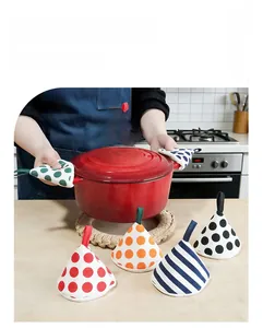 Detail of colorful polka dot and striped fabric cone pot holders with hanging loops