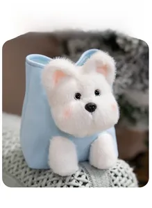 Detail of light blue plush bag with soft stuffed puppy face and 3D paw decorations
