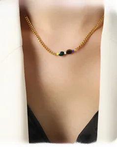 Detail of 18K gold plated chain necklace with colorful round natural stone beads