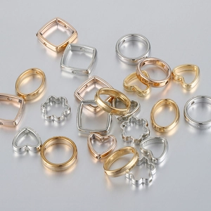 Assorted gold and silver geometric hollow charms including hearts and flowers for DIY jewelry