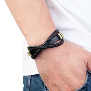 Men's multilayer braided black leather bracelet with golden stainless steel clasp on wrist