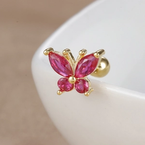 Macro view of gold butterfly ear stud featuring vibrant pink zircon stones for cartilage