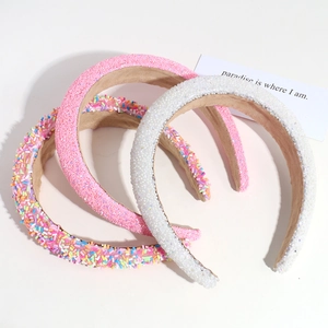 Three wide sponge headbands in pink, white and candy color with rhinestones and glitter