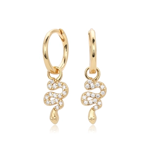 Macro shot of gold-plated snake earrings with micro-pave white cubic zirconia stones
