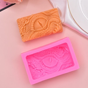Pink silicone dragon eye mold with detailed scale texture for DIY soap and cake decor