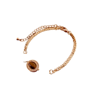 Gold plated Cuban chain bracelet featuring oval tiger eye stone and zircon halo detail
