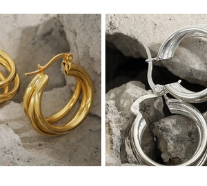 Detail of S925 sterling silver geometric multi-layer hoop earrings in gold and silver