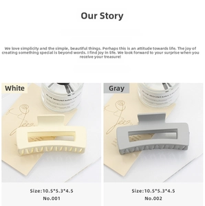 Detailed view of large matte square hair claws in white and grey colors, 10.5cm size